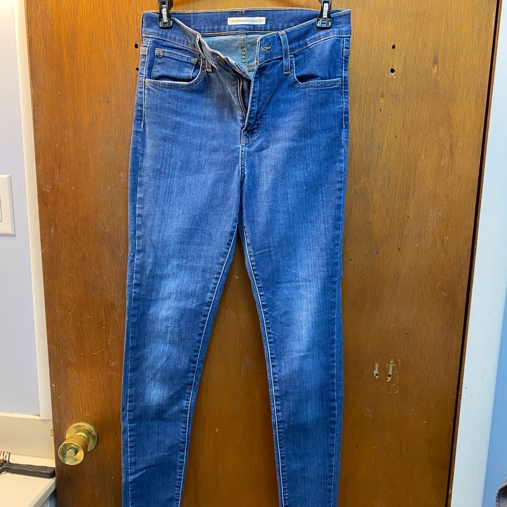 Women’s Levi Strauss & Co high rise supper skinny jeans size 27 waist.
